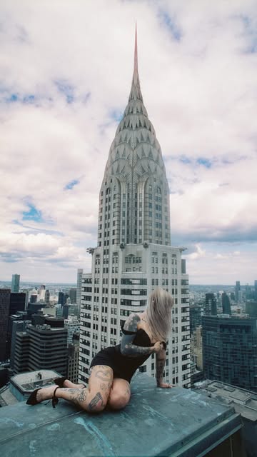 Casper on a New York ledge beside the Chrysler Building